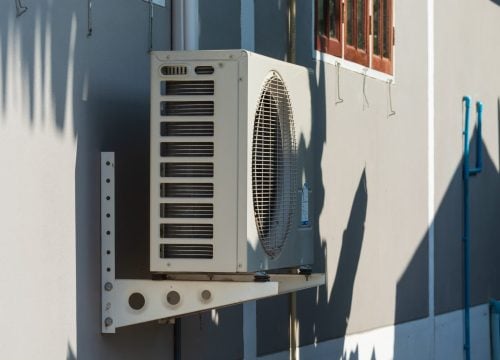 air-conditioner-against-building-min
