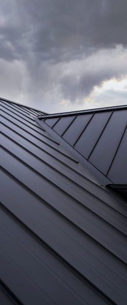 low-angle-modern-house-roof-clouds-min
