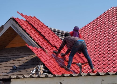 low-angle-view-man-working-construction-site-against-clear-sky-min