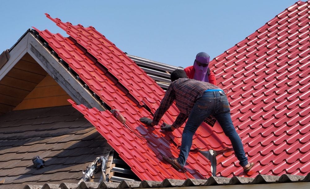 low-angle-view-man-working-construction-site-against-clear-sky-min