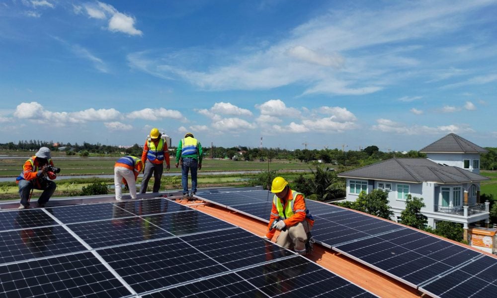 top-aerial-engineer-men-inspects-construction-solar-cell-panel-photovoltaic-cell-roof-min